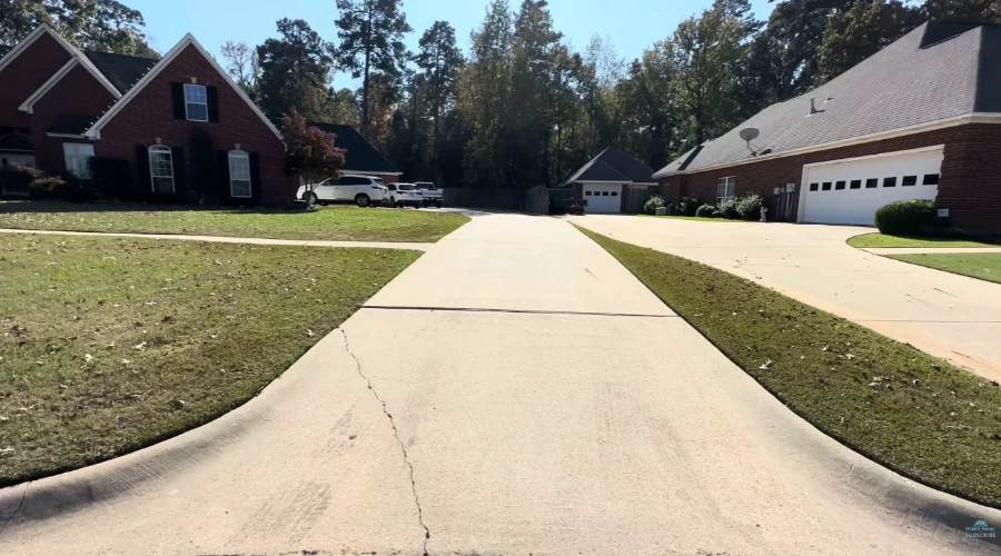 Technician pressure washing a residential driveway in Jacksonville, FL