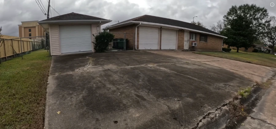 Stained concrete driveway before pressure washing in Jacksonville, FL