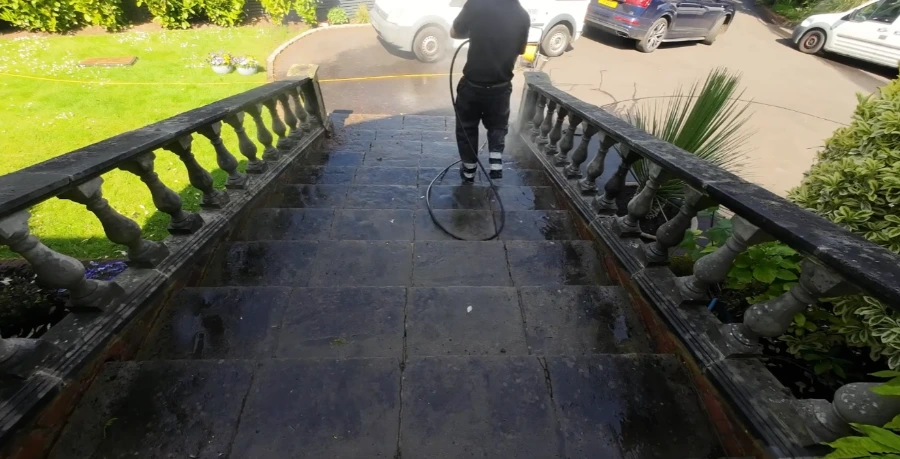 Pressure washing a stone staircase and patio in Jacksonville, FL